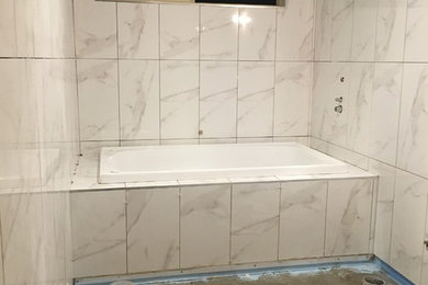 Small traditional bathroom in Sydney with white cabinets, a drop-in tub, a one-piece toilet, white walls, ceramic floors, an integrated sink, beige floor and an open shower.