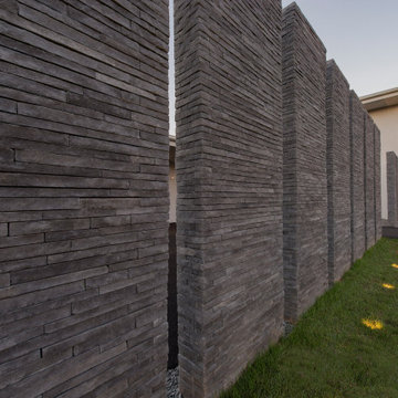 Walker Road Great Falls, Virginia modern home textured stacked stone fence & out