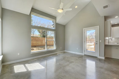 Minimalist concrete floor living room photo in Austin