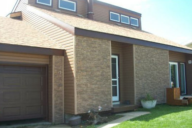 Brown two-story mixed siding exterior home photo in Other