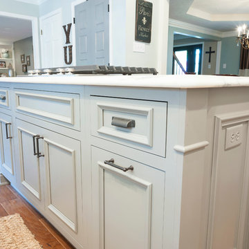 Decorative moldings on transitional gray island