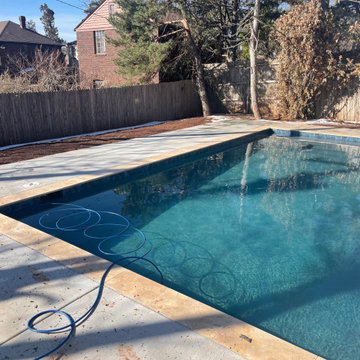 Small Concrete Pool with Travertine Coping