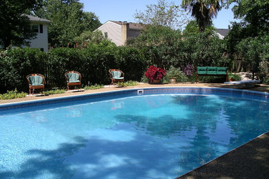 Example of a large classic backyard concrete and kidney-shaped natural pool design in Other