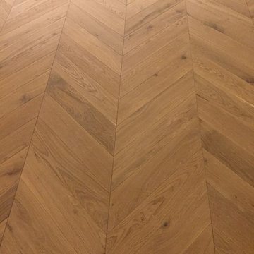 Chevron parquet supply and installation. Luxury residential apprtments.
