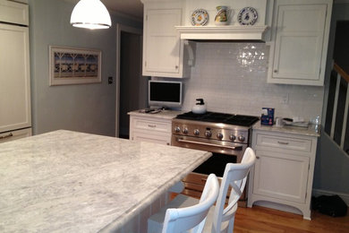 Inspiration for a contemporary medium tone wood floor eat-in kitchen remodel in New York