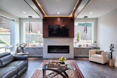 Large minimalist open concept dark wood floor, brown floor, exposed beam and wall paneling family room photo in Seattle with white walls, a ribbon fireplace, a tile fireplace and a wall-mounted tv