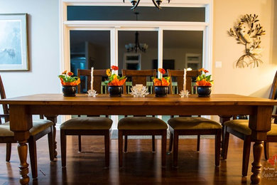 Example of a large trendy medium tone wood floor kitchen/dining room combo design in Ottawa with gray walls