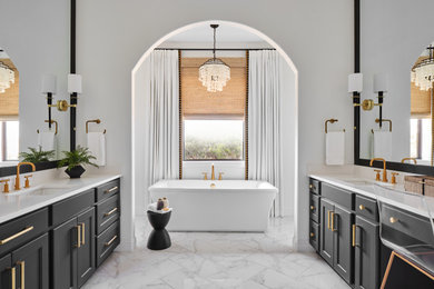 Example of a large transitional master white tile and porcelain tile porcelain tile, gray floor and double-sink bathroom design in Austin with shaker cabinets, black cabinets, a two-piece toilet, white walls, an undermount sink, quartz countertops, a hinged shower door, white countertops and a built-in vanity