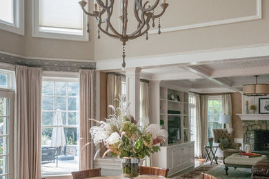 Inspiration for a mid-sized traditional dining room in New York with beige walls and dark hardwood floors.