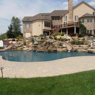 North Whitehall custom pool with boulder waterfall, slide, & separate spa