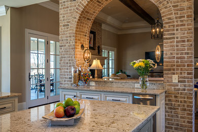 Open concept kitchen - traditional u-shaped open concept kitchen idea in Nashville with beaded inset cabinets, distressed cabinets, granite countertops, stainless steel appliances and an island