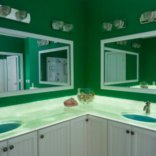 Bathroom - large beach style master stone slab light wood floor bathroom idea in Charlotte with beaded inset cabinets, white cabinets, green walls, an undermount sink, onyx countertops and green countertops