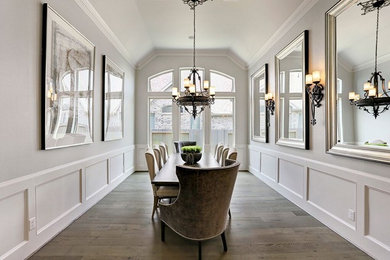 Dining room - large traditional light wood floor and brown floor dining room idea in Houston with gray walls