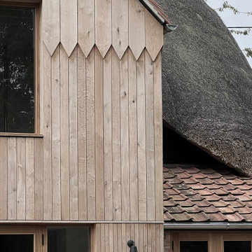 Chevron oak cladding to two storey element