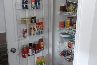 Reach-in closet - mid-sized modern reach-in closet idea in Other