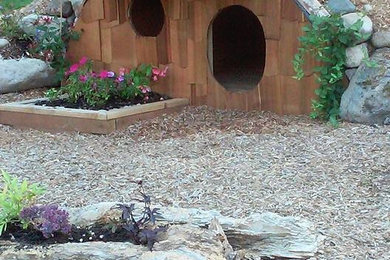 Design ideas for a large backyard shaded garden for spring in Seattle with mulch.