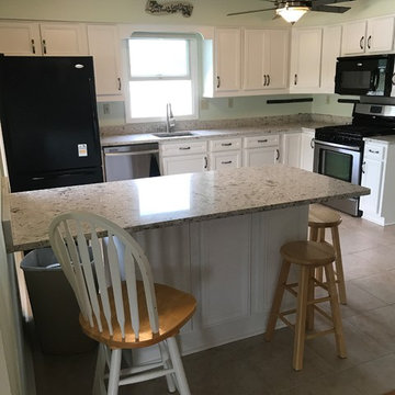 cabinet refacing--white cabinets with new quartz countertops
