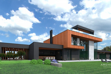 Cette photo montre une grande façade de maison tendance à un étage avec un revêtement mixte et un toit plat.
