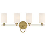 Savoy House - Woodbury 4-Light Warm Brass Bath Bar - A graceful scroll flourish distinguishes the Woodbury Collection of bath bars. Measuring 28" wide x 12" high x 7" extension, this four-light bath bar in a versatile pairing of a Warm Brass finish with White glass provides ample illumination from four 60-watt Edison-base bulbs.