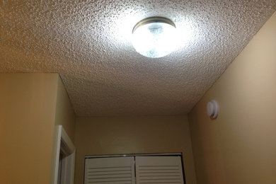 Get rid of popcorn! Just cover it up! Use stretch ceiling