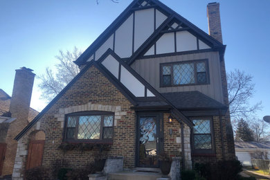 Mid-sized french country gray two-story mixed siding exterior home idea in Chicago with a shingle roof