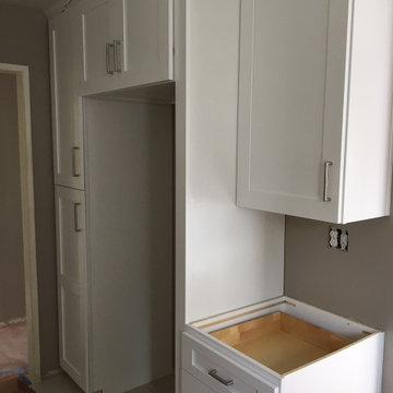 Kitchen white shaker cabinets Bathroom white shaker vanity with grey quartz tops
