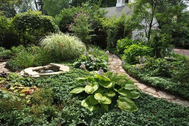 Photo of a large contemporary full sun courtyard stone landscaping in Chicago for spring.