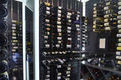 Wine cellar - large contemporary porcelain tile wine cellar idea in Dallas