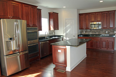 Example of a classic kitchen design in Other