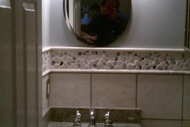 Mid-sized 3/4 beige tile and ceramic tile bathroom photo in Detroit with a drop-in sink and blue walls