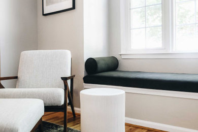 Inspiration for a mid-sized transitional medium tone wood floor living room remodel in Other with gray walls