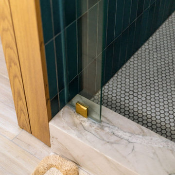 Teal tile and marble threshold — 90s Fixer, Reno interior design by Find Design