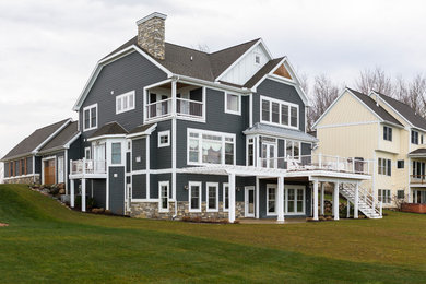 This is an example of a beach style home design in Grand Rapids.