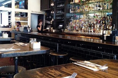 Inspiration for a rustic home bar remodel in Los Angeles