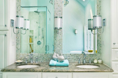 Mid-sized transitional master green tile marble floor and green floor bathroom photo in Richmond with raised-panel cabinets, white cabinets, a two-piece toilet, green walls, an undermount sink, granite countertops, a hinged shower door and green countertops
