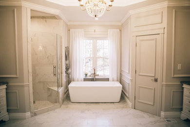 Photo of a traditional bathroom in Birmingham with a freestanding tub, an alcove shower, white tile, porcelain tile, grey walls, porcelain floors, a drop-in sink, white floor and a hinged shower door.