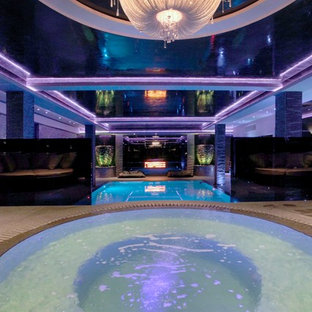 Inspiration för mycket stora moderna rund, inomhus pooler, med spabad