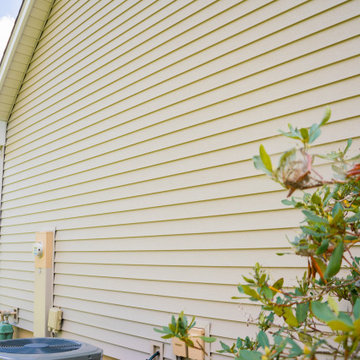 Seamless Polymer Siding in Mountain Clay w/ Energy Efficient Replacement Windows