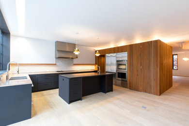 Example of a mid-sized kitchen design in New York