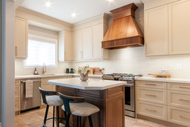 Transitional l-shaped beige floor kitchen photo in Toronto with an undermount sink, recessed-panel cabinets, beige cabinets, white backsplash, stainless steel appliances, an island and white countertops