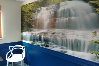 Waterfall wallpaper mural, blue paint, white spaghetti chair