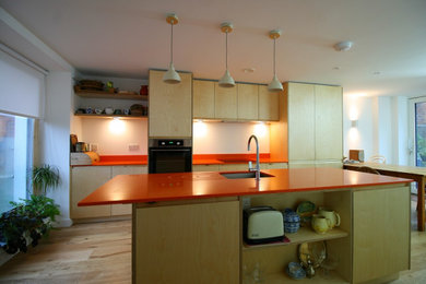 This is an example of a mid-sized contemporary kitchen in Sussex.