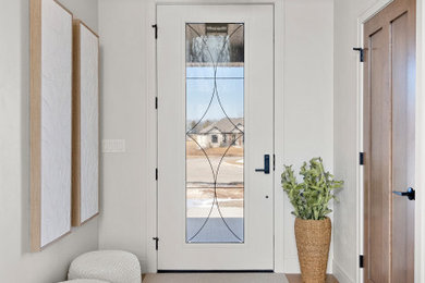 Entryway - mid-sized transitional medium tone wood floor, brown floor and tray ceiling entryway idea in Other with white walls and a white front door