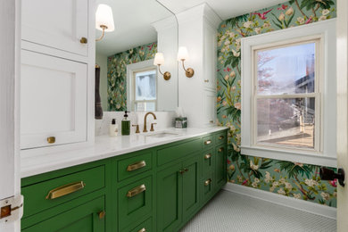 Mid-sized transitional 3/4 white tile mosaic tile floor, white floor, single-sink and wallpaper alcove shower photo in Columbus with shaker cabinets, green cabinets, green walls, an undermount sink, quartz countertops, a hinged shower door, white countertops and a built-in vanity