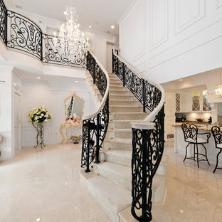 Victorian staircase in Other with marble treads and marble risers.