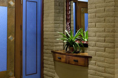 Entryway - mid-sized transitional ceramic tile and beige floor entryway idea in Denver with beige walls and a medium wood front door