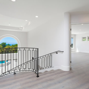 Second-Floor Gallery Landing with Wide Plank Flooring & Double Door Suite Entry 