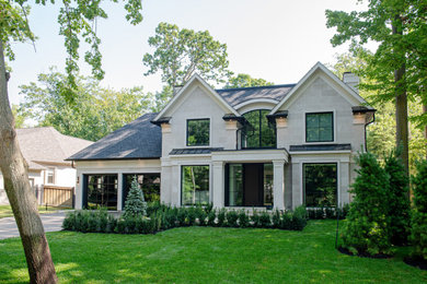 Large transitional two-story stone exterior home photo in Toronto with a shingle roof and a gray roof