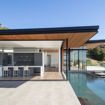 Open Living Pavilion with Pool and Hillside Views