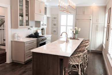 Mid-sized transitional dark wood floor and brown floor eat-in kitchen photo in Other with a farmhouse sink, recessed-panel cabinets, white backsplash, ceramic backsplash, paneled appliances and an island